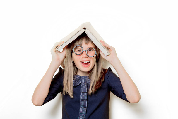 Portrait of a nerd girl in glasses with books - Foto, Imagem