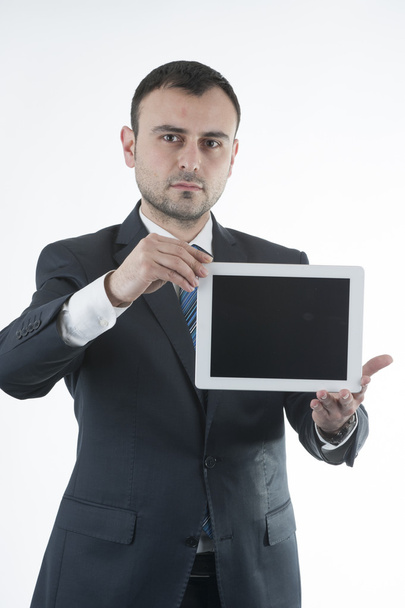Businessman shows tablet - Фото, зображення