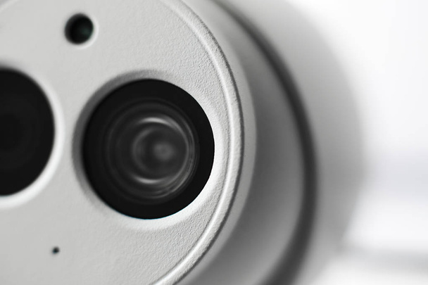 White security cctv dome type camera close-up. Lens and ir. - Fotoğraf, Görsel