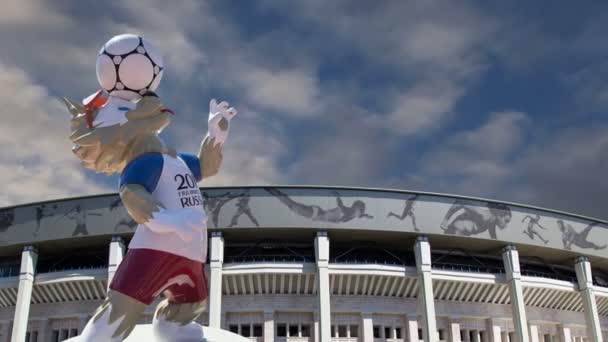 MOSCOW, RUSSIA  AUGUST 10, 2018: Official mascot of the 2018 FIFA World Cup in Russia-- wolf Zabivaka and Luzhniki Olympic Complex -- Stadium for the 2018 FIFA World Cup. Moscow - Кадры, видео