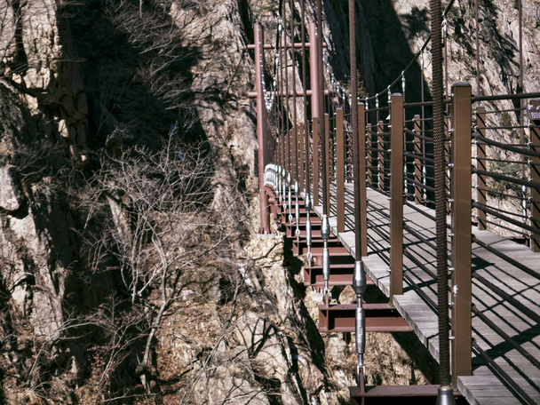 Suspension bridge in the beautiful mountains Seoraksan. Side view - Photo, Image