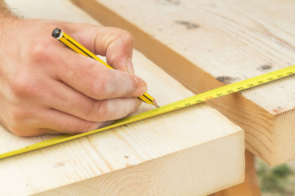 Carpenter working on raw wood. - Photo, Image