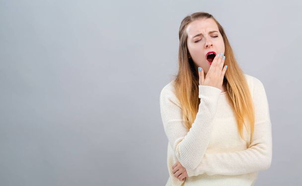 Young woman yawning - Photo, Image