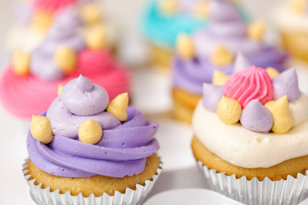 Unicorn theme vanilla cupcakes for kids birthday party. - Photo, Image