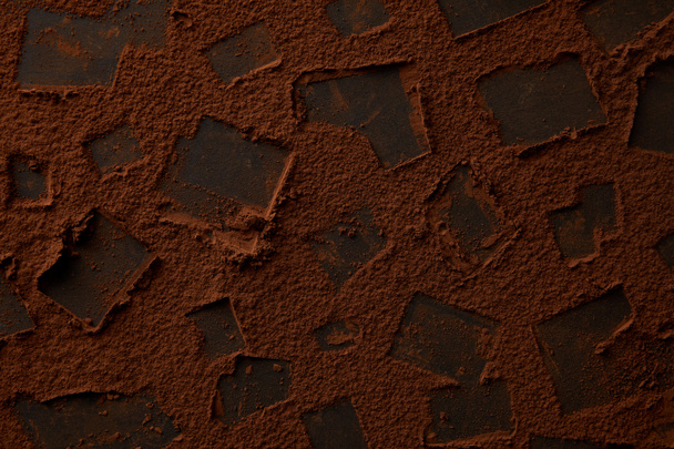 top view of chocolate background with gourmet cocoa powder - Φωτογραφία, εικόνα