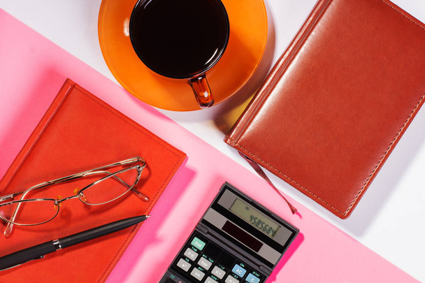Office table with pen, calculator. Colour. Flat lay top view - Foto, Imagen