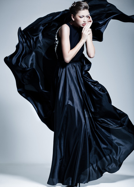 beautiful woman model dressed in an elegant dress in a fashion pose - Fotoğraf, Görsel