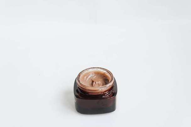 chocolate cream in small jar on white background - Zdjęcie, obraz