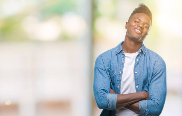 Young african american man over isolated background happy face smiling with crossed arms looking at the camera. Positive person. - Foto, imagen