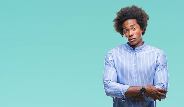 Afro american man over isolated background skeptic and nervous, disapproving expression on face with crossed arms. Negative person. - Foto, Bild