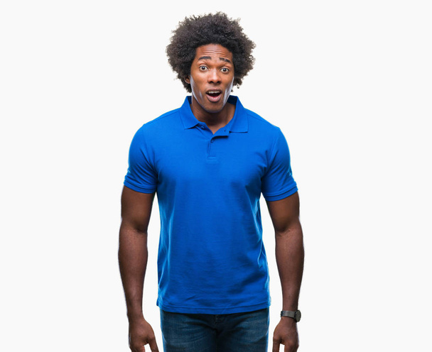 Afro american man over isolated background afraid and shocked with surprise expression, fear and excited face. - Photo, Image