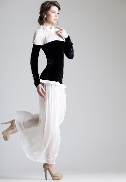 beautiful woman model posing in elegant dress in the studio - Fotó, kép