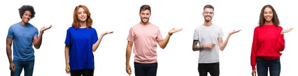 Composition of african american, hispanic and caucasian group of people over isolated white background smiling cheerful presenting and pointing with palm of hand looking at the camera. - Photo, Image