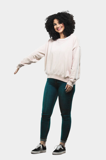 Full body young woman doing welcome gesture - Photo, image