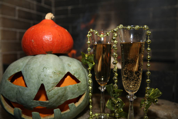 Halloween pumpkin in fireplace with fire - Photo, Image