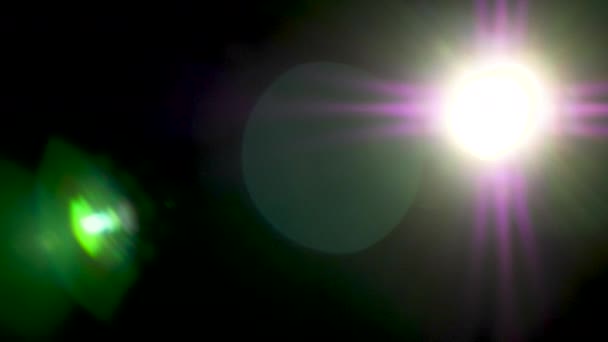 Big abstract lens flare on black background - Footage, Video