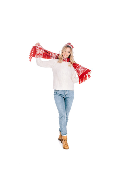 full length view of beautiful happy young woman in scarf and hat smiling at camera isolated on white  - Photo, Image