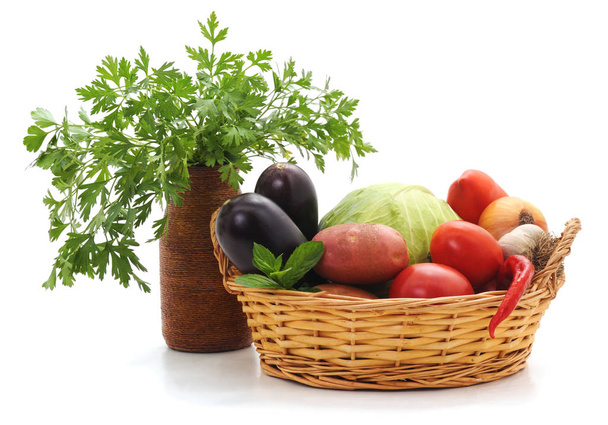 Vegetables in a basket isolated on a white background. - Φωτογραφία, εικόνα
