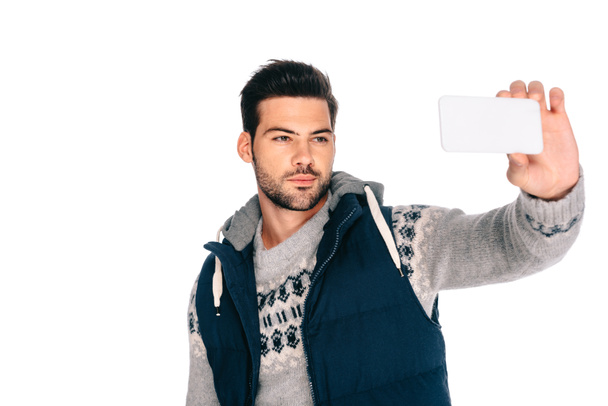 csinos fiatal ember vesz selfie, smartphone elszigetelt fehér - Fotó, kép
