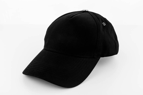 A baseball cap black with the inserted small ringlets - Zdjęcie, obraz