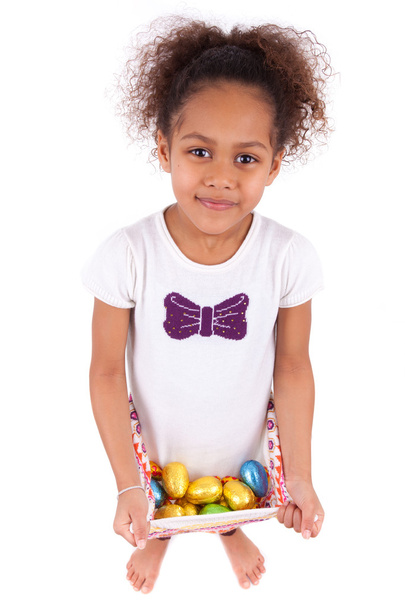 African Asian girl holding chocolate ester egg - Foto, afbeelding