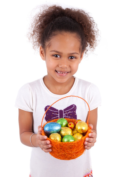 African Asian girl holding chocolate ester egg - Foto, imagen