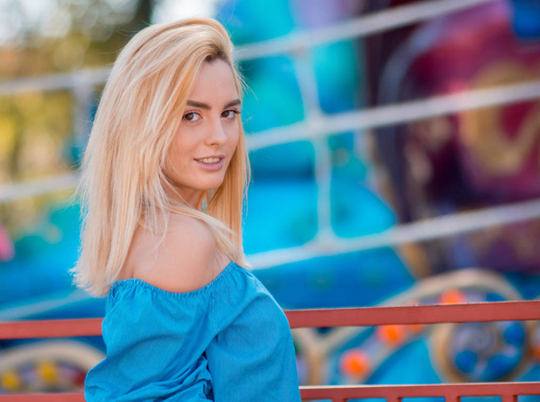 The close up portrait of beautiful young woman with blond hair smiling on a bright background. Summer portrait of a girl - Fotografie, Obrázek