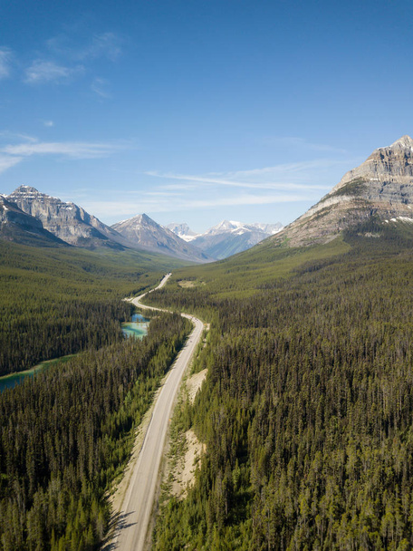 Aerial panoramic landscape view of a scenic road in the Canadian Rockies during a vibrant sunny summer day. Taken in Banff Windermere Parkway, Alberta, Canada. - Zdjęcie, obraz