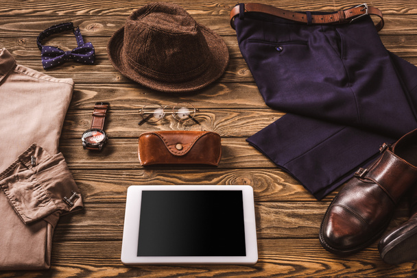 close up view of male accessories, stylish clothing and tablet on wooden tabletop - Foto, immagini