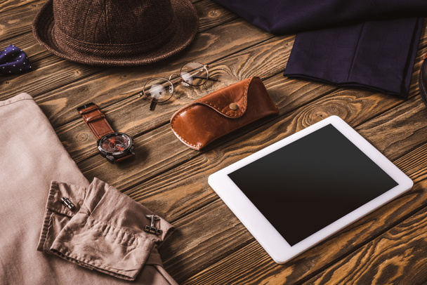 close up view of male accessories, stylish clothing and tablet on wooden tabletop - Foto, immagini