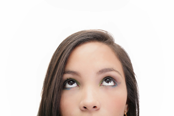 Closeup portrait of a beautiful young woman looking up, isolated - Photo, image