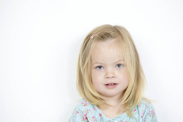 portrait of portrait of beautiful little girl in studio on white - Фото, изображение