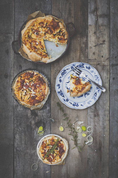 set of delicious quiches on wooden background - Zdjęcie, obraz