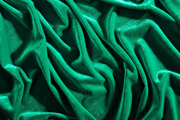 Emerald color velvet textiles for background or texture, wrinkled and shadows - Photo, Image