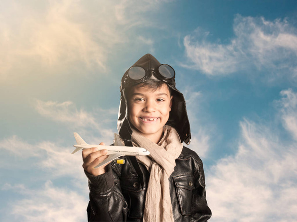little aviator holding an airplane - Foto, Bild