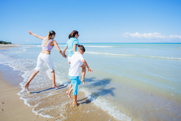Happy family having fun in the summer leisure - Foto, Imagen