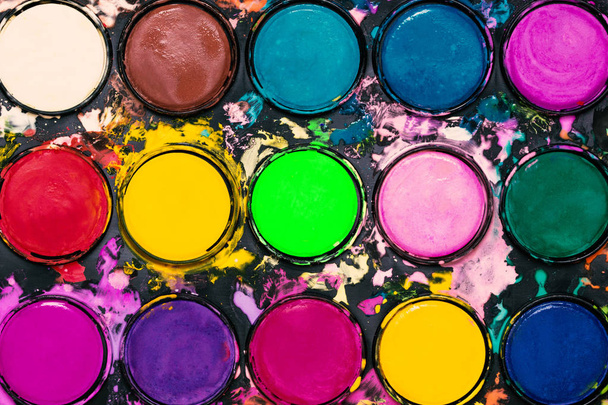 Watercolour paint palette. Colourful paint splash. Artistic background. - Photo, Image