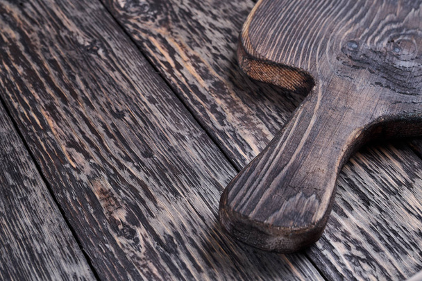 wooden cutting board on wooden background - Fotografie, Obrázek