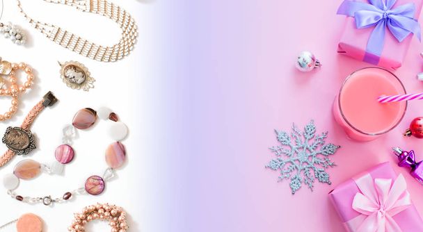 Banner Festive background for text composition flat lay Christmas items gift box ribbon bow pink glass cocktail Christmas toys fashion accessories for women jewelry pearl necklace bracelet . Top view copy space - Photo, Image