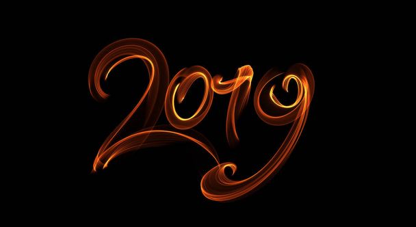 Happy new year 2019 isolated numbers lettering written with fire flame or smoke on black background - 写真・画像