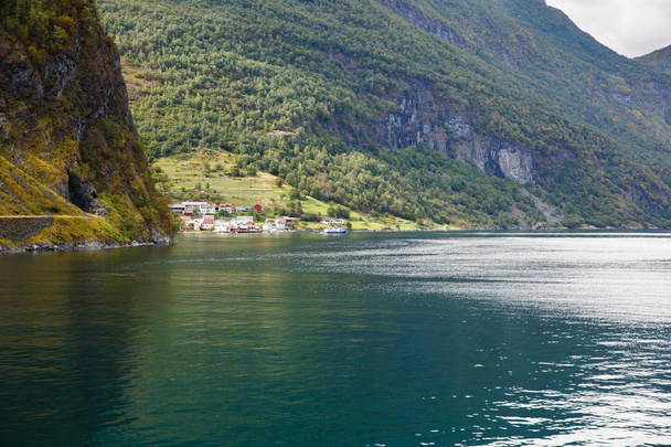 Landscape with Naeroyfjord, mountains and traditional village houses in Norway. - Foto, Imagen