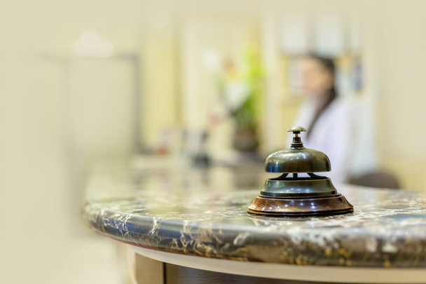 Modern luxury hotel reception counter desk with bell - Foto, imagen