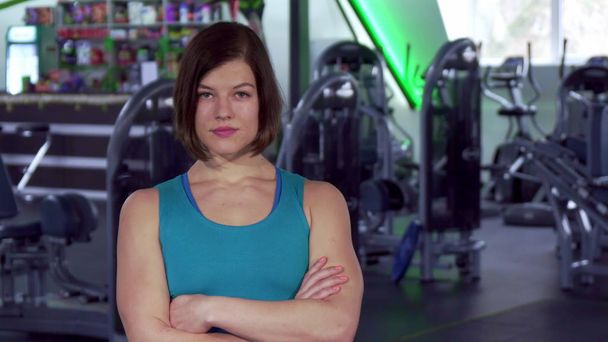 Fitness woman keeps arms crossed on her chest - Photo, Image