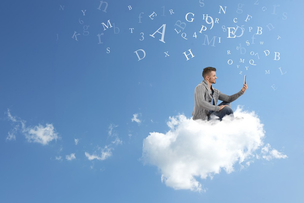 Businessman works over a cloud - Photo, Image