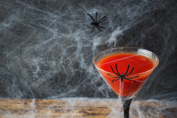Bloody Mary cocktail, spider web background for Halloween, selective focus. Copy space - Foto, Imagem