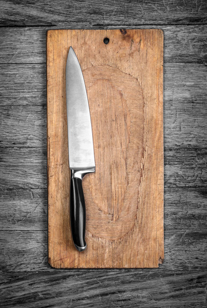 Overhead shot of bread board and nice and clean knife with space for text, menu or design - 写真・画像