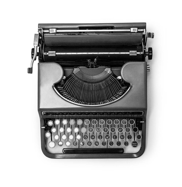 antieke schrijfmachine tegen een helder witte achtergrond. - Foto, afbeelding