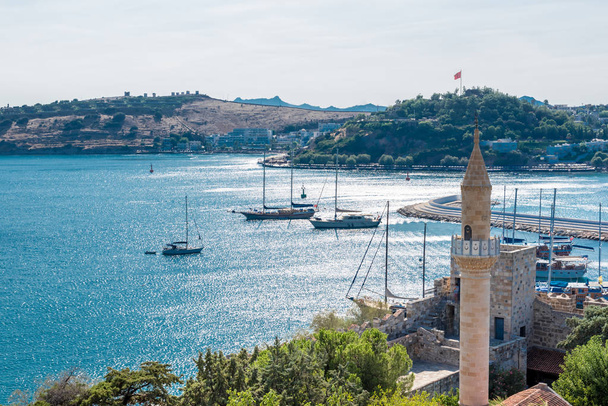 View of Mosque minaret,Aerial view of Castle of St. Peter or Bodrum Castle and Marine with yachts in Bodrum harbor in Turkey.Great blue sea view from the top of Bodrum Castl - Photo, Image