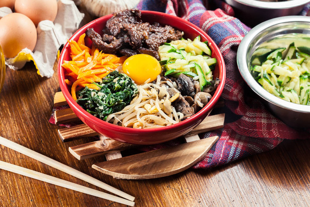 Bibimbap - rice with beef and vegetables. Traditional Korean dish. - Fotoğraf, Görsel
