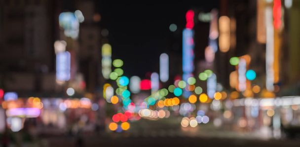 Tokio street bokeh kleurrijke achtergrond - Foto, afbeelding